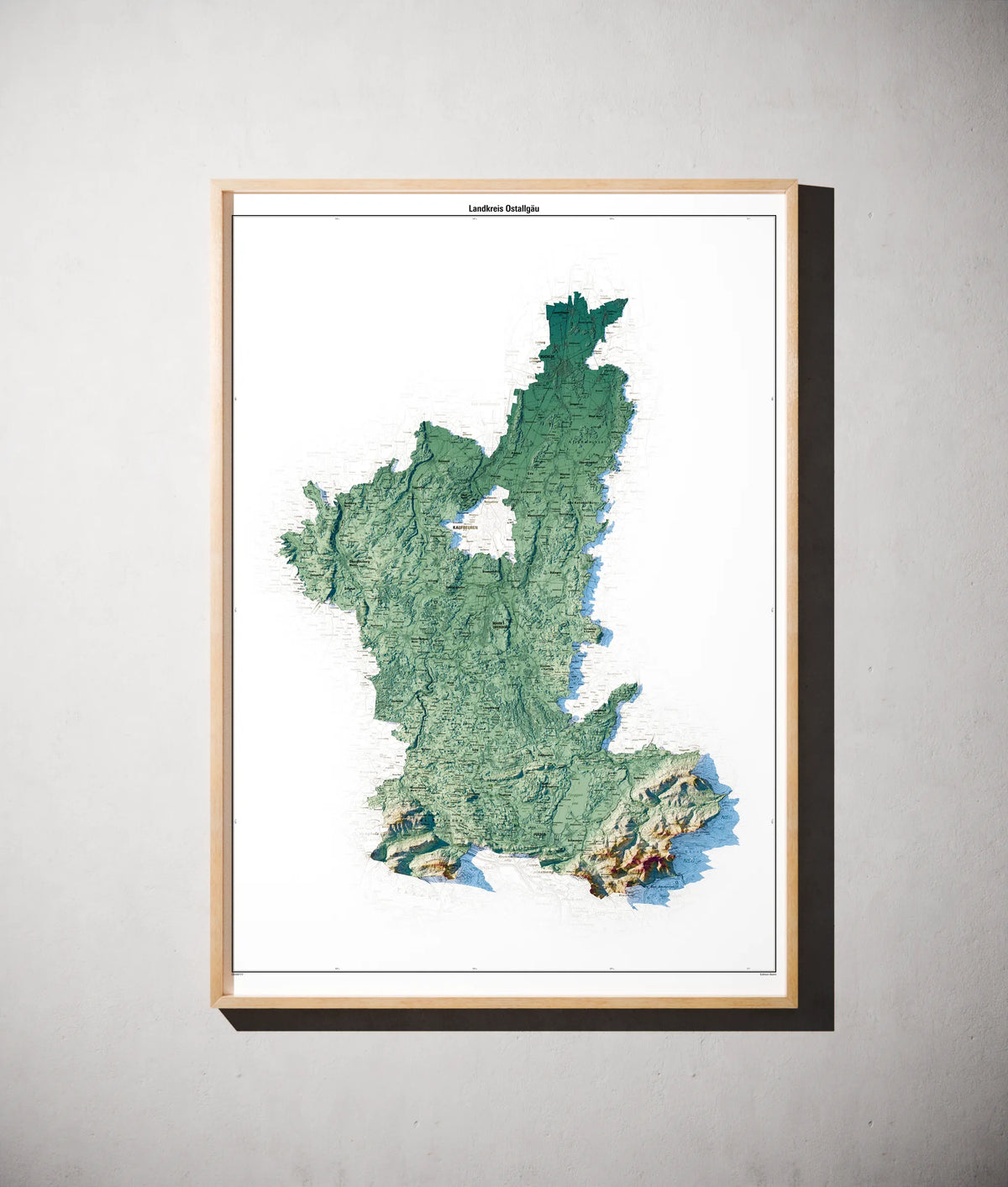 Landkreis Ostallgäu Poster als schattierte Reliefkarte, Farbvariante Petrol, gerahmt an einer Wand #c2